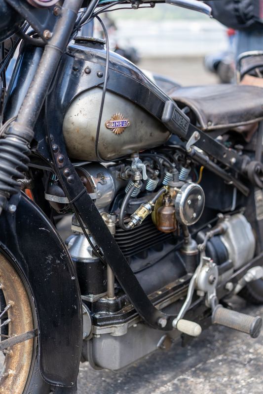 Close-up of the engine and tank of an old motorcycle